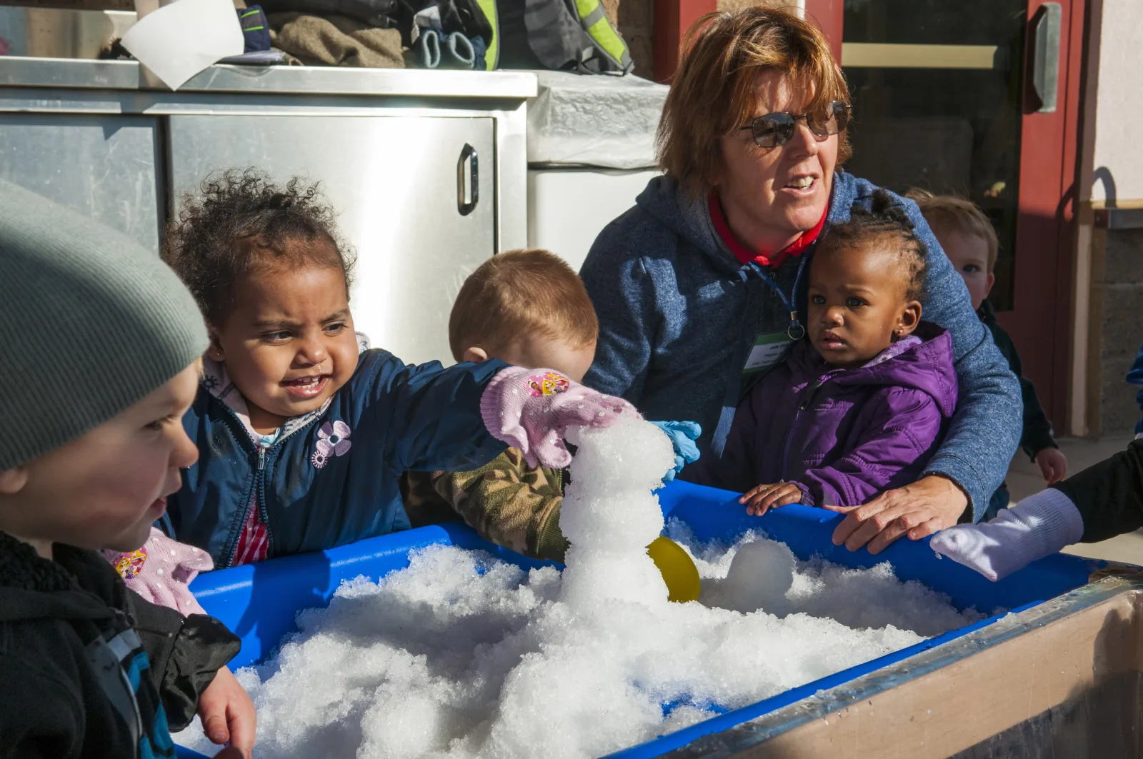 The teachers and children of the one-year-old class at Marine Corps Air Station Yuma’s Child Development Center play with homemade snow Jan. 11, 2013. The teachers decided to make their own snow from a shaved ice machine to share an iconic winter experience with the children, some of whom had never seen snow before. With nary a snowman lasting more than a heartbeat against the onslaught of playtime, today was a day for these kids, or at least the teachers, to remember.
Unit: Marine Corps Air Station Yuma