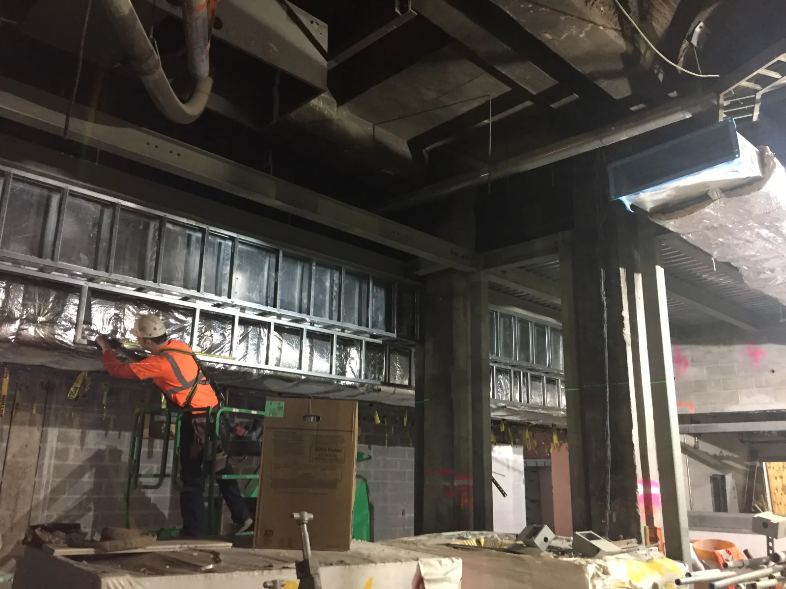 Installation of the ceiling soffit along the west side of the 44th Street node of the future LIRR passenger concourse. (CM014B, 02-18-2019)