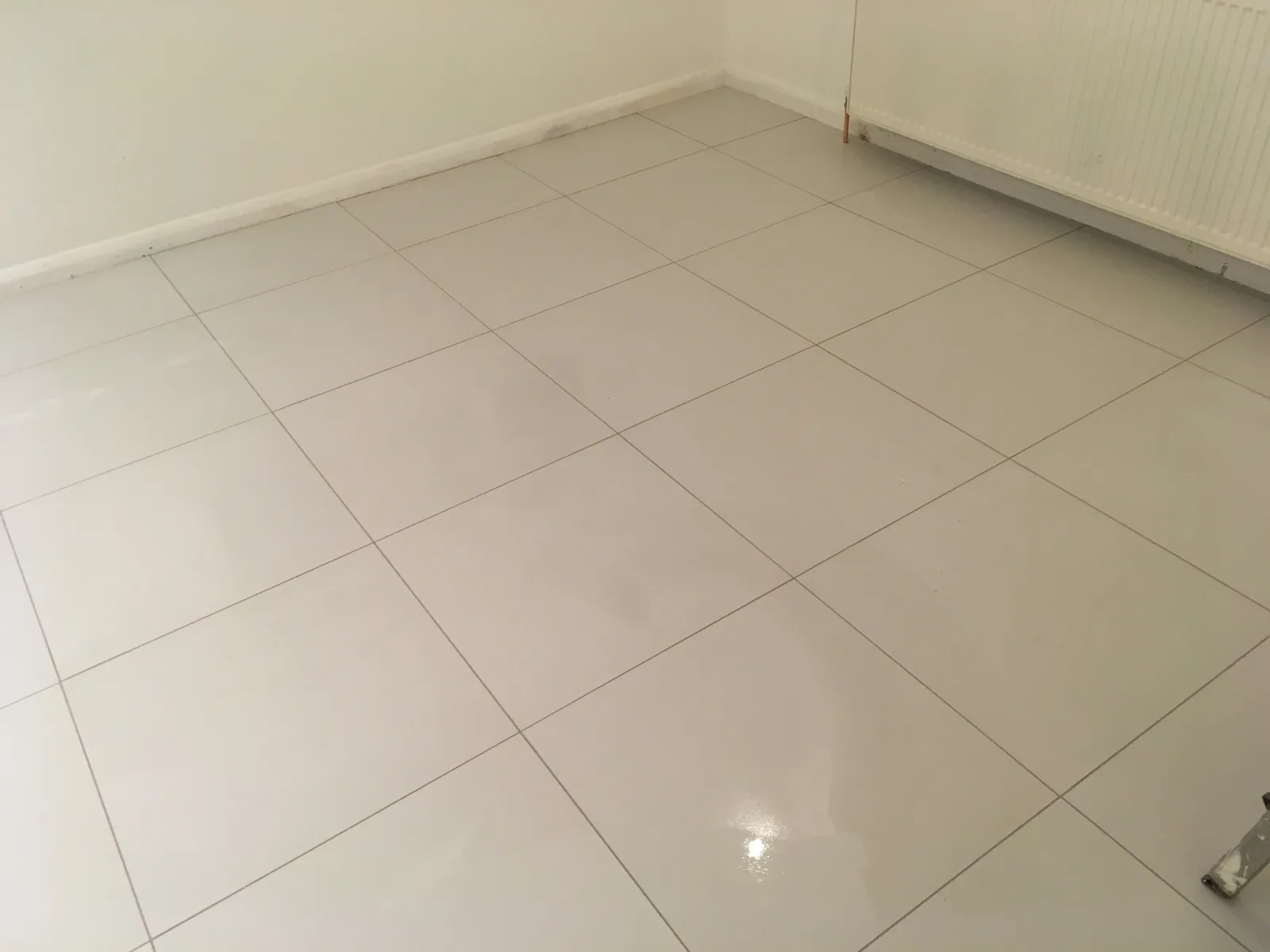 Modern polished porcelain floor tiles in a large format.