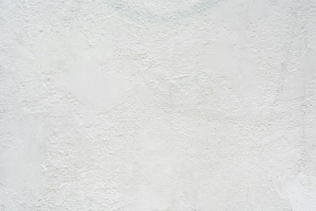 white textured plaster wall surface