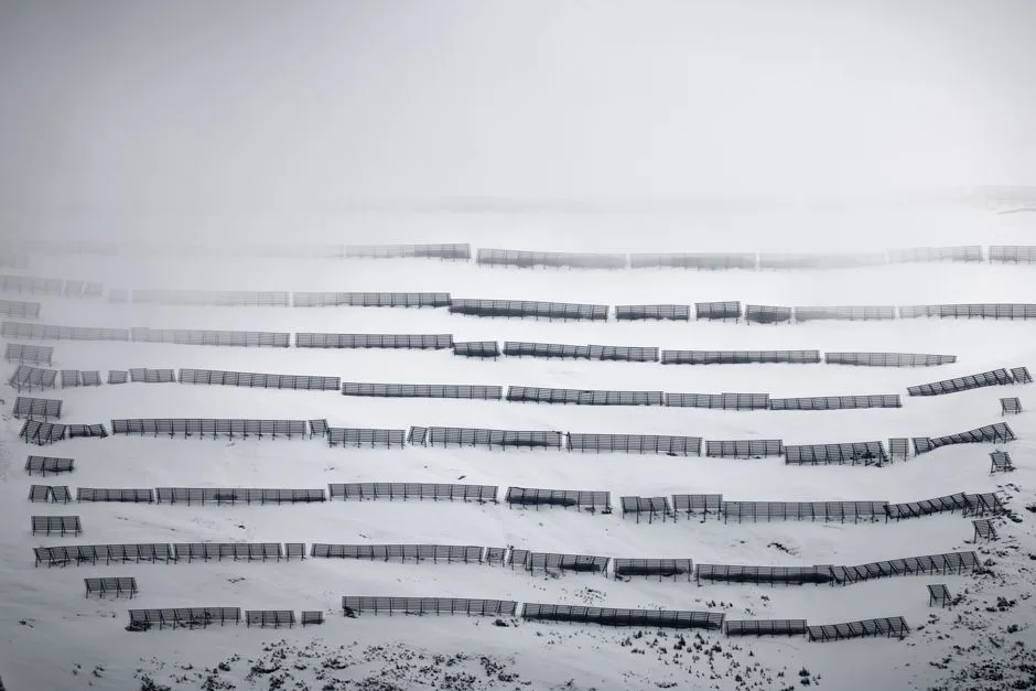 Captivating winter landscape of snow fences in Hintertux, Tirol, Austria.