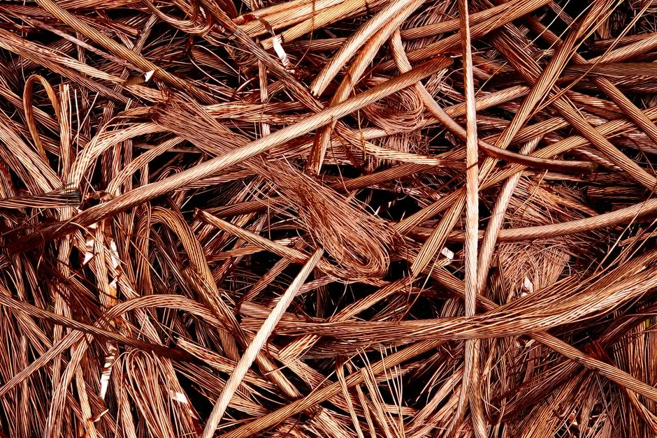 Close-up view of intertwined copper wires ready for recycling, emphasizing industrial reuse.