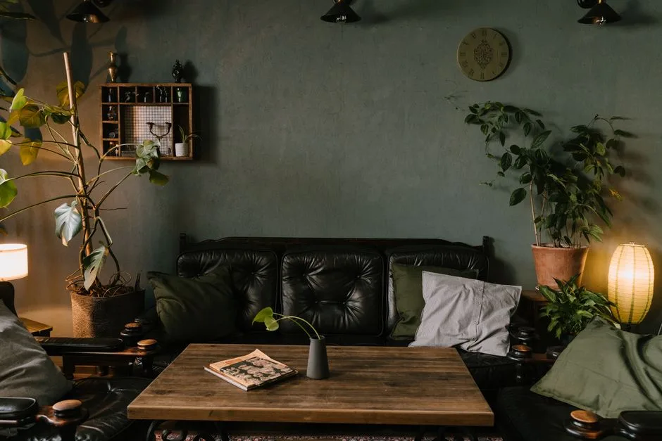 A stylish living room with indoor plants and warm lighting creates a cozy atmosphere. Perfect for interior design inspiration.