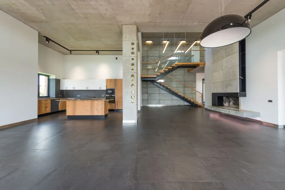 Spacious loft hallway and open plan kitchen in contemporary house with minimalist luxury style interior design