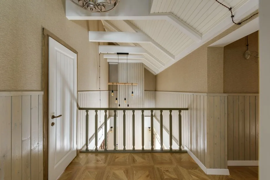 A beautifully designed interior showcasing wooden paneling and modern lighting in a hallway.