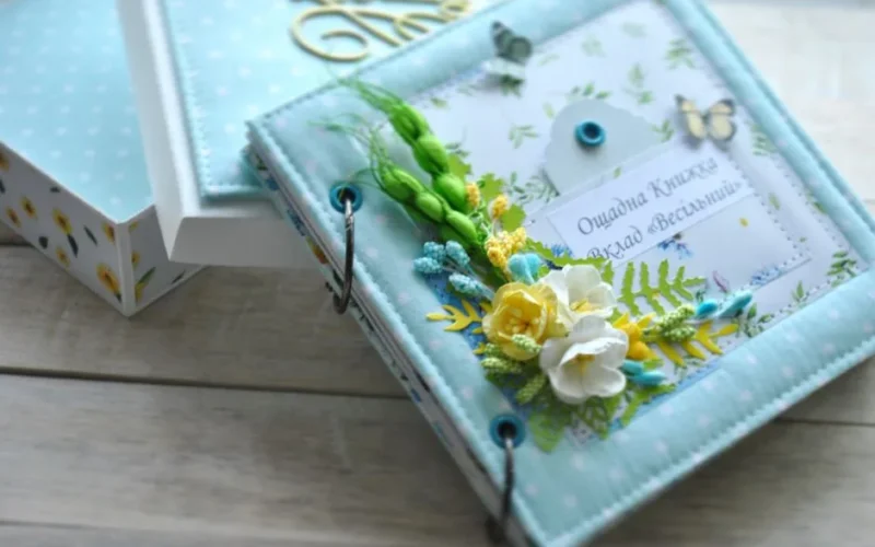 Beautiful handmade scrapbook with floral decorations, perfect for capturing wedding memories.