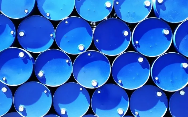 Top view of stacked blue industrial drums forming a geometric pattern.