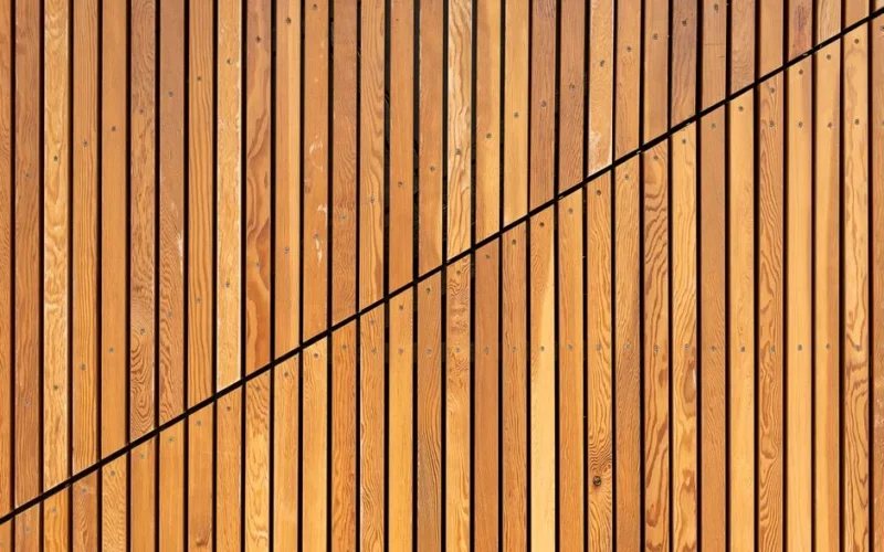 A close-up of wooden slats creating a modern diagonal pattern, ideal for backgrounds.