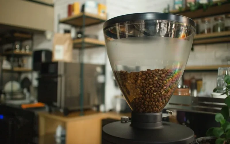 Close-up of coffee beans in a grinder at a cozy café in Eskişehir, Turkey.