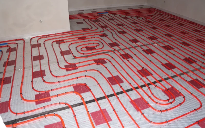 Hot water underfloor heating system installed onto polystyrene insulated floor. This photo has been released into the public domain. There are no copyrights: you can use and modify this photo without asking and without attribution.