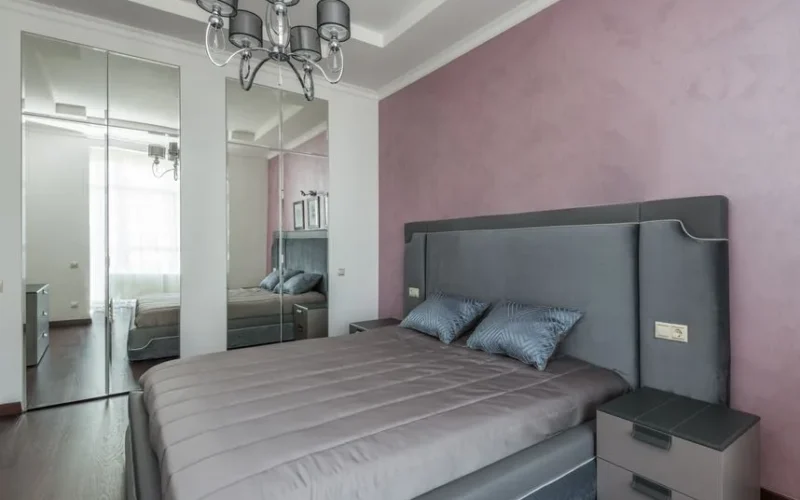 Contemporary bedroom interior design featuring elegant furnishings and a soft color palette.