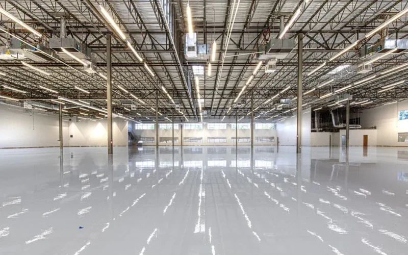 Spacious and polished industrial facility with glossy epoxy flooring in Houston, Texas.