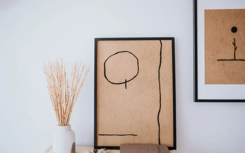 Elegant Japandi-style room with minimalist art, vases, and natural decor.