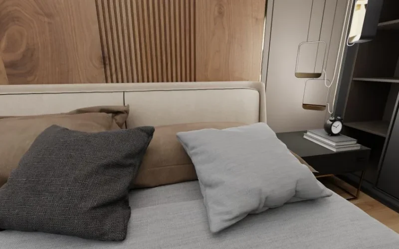Stylish bedroom with soft pillows, wooden paneling, and elegant accessories for a cozy feel.