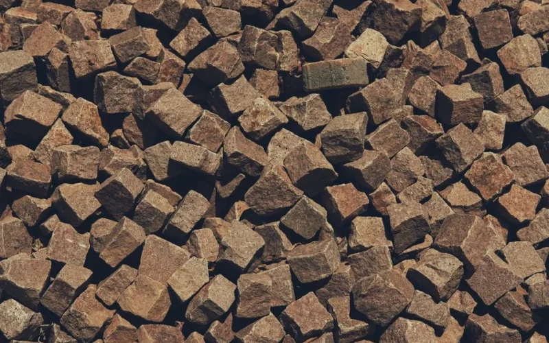 Close-up view of brown cobblestone paving stones in Marrakesh, Morocco, showcasing texture and pattern.
